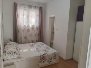 Postel nebo postele na pokoji v ubytování Apartment Eva