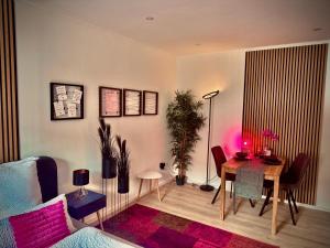 a living room with a table and a dining room at Three Rivers 3 in Passau