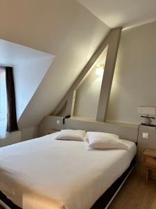Postel nebo postele na pokoji v ubytování Le Relais de la Sans Fond
