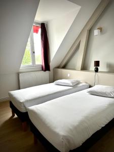 Postel nebo postele na pokoji v ubytování Le Relais de la Sans Fond