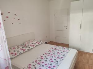 Postel nebo postele na pokoji v ubytování Apartment Eva