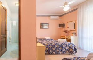 Postel nebo postele na pokoji v ubytování Hotel Marnie