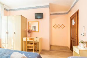 Postel nebo postele na pokoji v ubytování Hotel Marnie