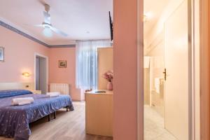 Postel nebo postele na pokoji v ubytování Hotel Marnie