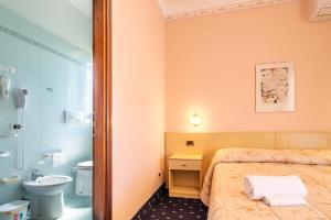 Postel nebo postele na pokoji v ubytování Hotel Marnie