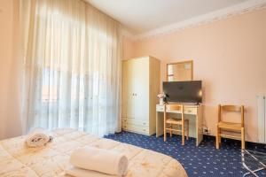 Postel nebo postele na pokoji v ubytování Hotel Marnie