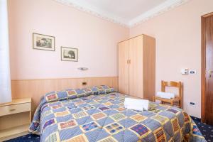Postel nebo postele na pokoji v ubytování Hotel Marnie