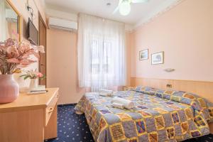 Postel nebo postele na pokoji v ubytování Hotel Marnie
