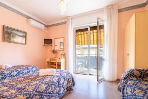 Postel nebo postele na pokoji v ubytování Hotel Marnie