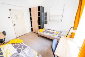 Postel nebo postele na pokoji v ubytování Hostel Hlávkova + 2 fotografie