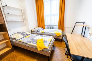 Postel nebo postele na pokoji v ubytování Hostel Hlávkova