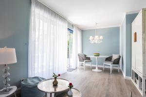 Posezení v ubytování Ferienwohnungen Krumpendorf am Wörthersee + 12 fotografií