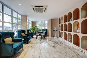 Posezení v ubytování Astra Hotels & Suites - Koramangala