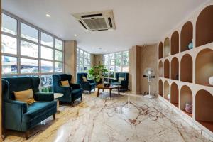 Posezení v ubytování Astra Hotels & Suites - Koramangala