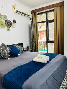 Postel nebo postele na pokoji v ubytování Goaround Homes Kalkaji, South Delhi