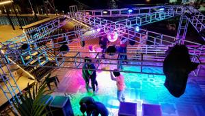 a group of people on a stage with lights at Heart Beat Resort in Shivpuri