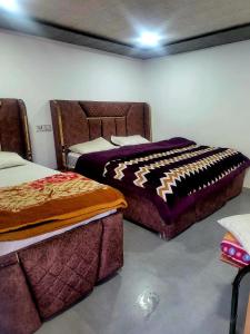 En eller flere senge i et værelse på Heart Beat Resort