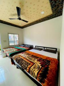 En eller flere senge i et værelse på Heart Beat Resort