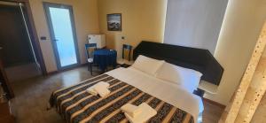 Ліжко або ліжка в номері Hotel Vlora