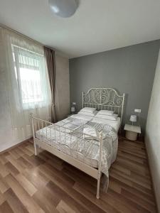 Postel nebo postele na pokoji v ubytování Mirabell apartman