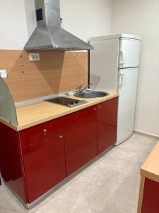 a kitchen with a sink and a refrigerator at Miramar Palace 615 in Sunny Beach