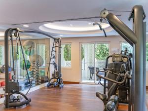 a gym with treadmills and exercise equipment in a house at Ali Bey Resort Sorgun in Side