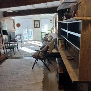 a living room with a couch and a fireplace at Apartamento Kuttun Bermeo in Bermeo