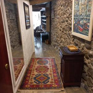 a hallway with a door and a rug on the floor at Apartamento Kuttun Bermeo in Bermeo