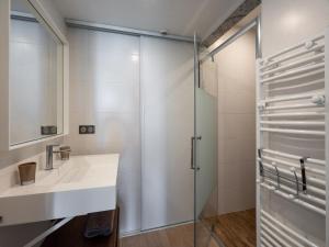a bathroom with a sink and a glass shower at Villa Marina N173 - 5P6 in Le Grau-du-Roi