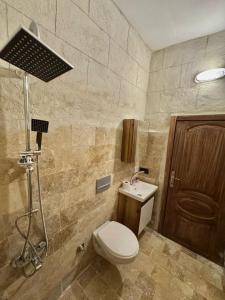 a bathroom with a toilet and a sink at Evra Cappadocia Hotel in Nevşehir
