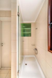 a shower with a glass door in a bathroom at Anastasia Suite Of The Sun&Sea, By Idealstay Experience in Kokkíni Khánion +12 photos