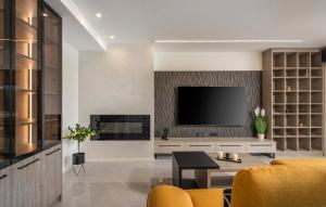 a living room with a television on a wall at Villa Aris by Villas Guide in Urinj