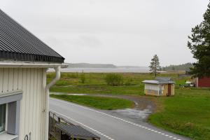a view of a road next to a house at Guestly Homes - 3BR Spacious Coastal Stay in Luleå