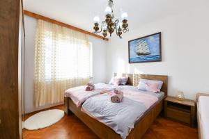 Postel nebo postele na pokoji v ubytování Apartman PIK