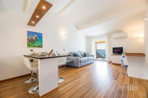 A television and/or entertainment centre at Beach | Parking | Wifi | A/C| Sea View By Tilo Még 36 kép