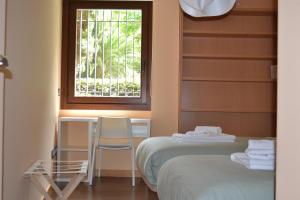 A bed or beds in a room at Apartamentos Suites&Homes