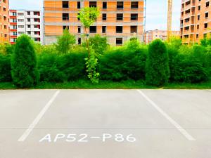 an empty parking lot with trees and buildings at ChicStudio Full Kitchen AC Free Parking Popcorn in Chiajna