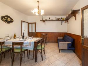 a dining room with a table and chairs at Holiday Home Bienna Antica by Interhome in Verbania