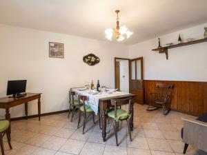 a dining room with a table and chairs at Holiday Home Bienna Antica by Interhome in Verbania +26 photos