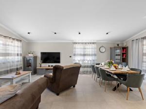 a living room with a couch and a table at Holiday Home Vala by Interhome in Vodnjan