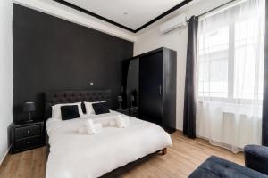 Posteľ alebo postele v izbe v ubytovaní Neo Luxury Suite