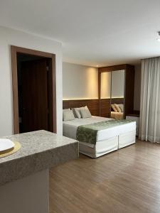 Postel nebo postele na pokoji v ubytování Vista Azul Apart Hotel - Vista Pinheiros