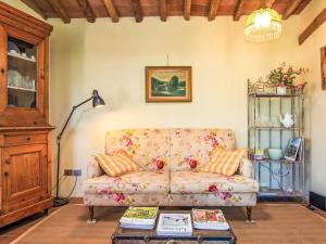 a living room with a couch and a table at Holiday Home Il Fienile by Interhome in Scandicci