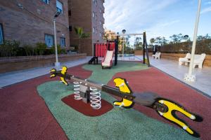 a toy gun on a carpet in a playground at Apartamento en Magic World in Oropesa del Mar