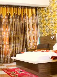 Katil atau katil-katil dalam bilik di Hotel Press Pure veg