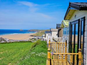 a row of houses with a view of the beach at Sea views at Serenity! in Truro