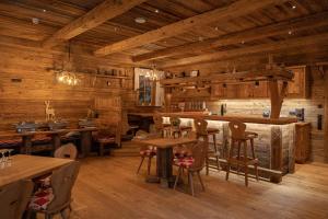a restaurant with wooden walls and tables and chairs at K-Apart Hotel & Boardinghouse in Hürth +32 photos