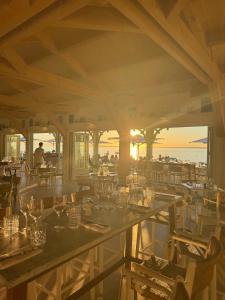 a restaurant with a view of the ocean at Hôtel de la Plage - Ronce-les-bains in Ronce-les-Bains