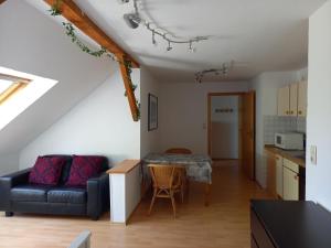 a living room with a couch and a table at Ulfershausen in Wangerland