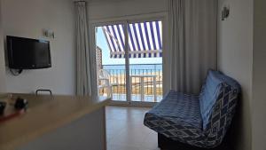 TV a/nebo společenská místnost v ubytování Apartaments Les Roques